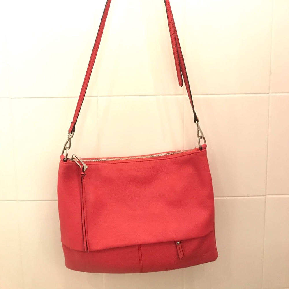 A soft-red large satchel with adjustable strap